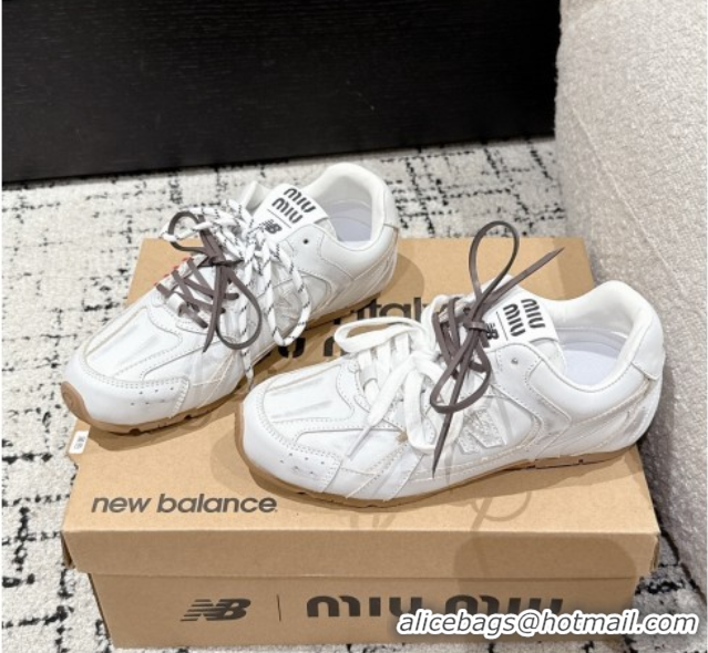 Shop Duplicate New Balance x Miu Miu 530 Sneakers in Faded Leather White 0603138