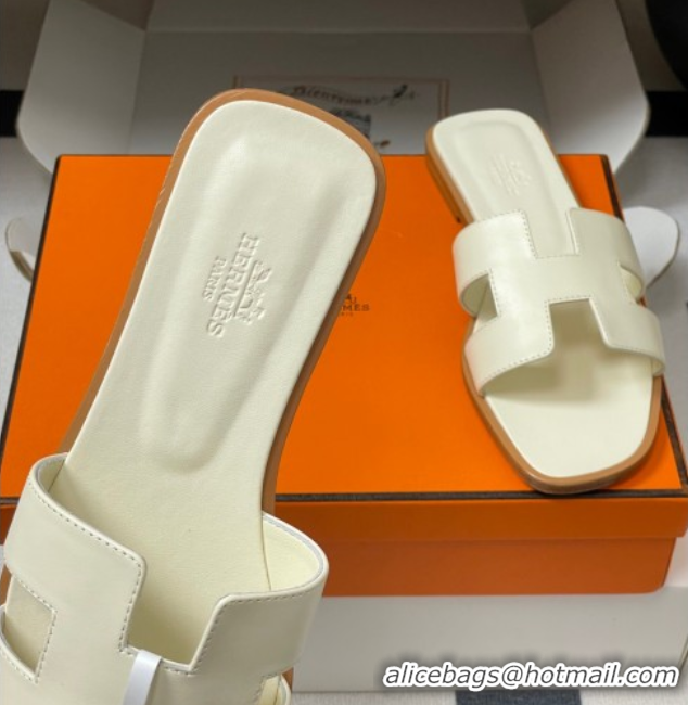 Buy Luxury Hermes Oran Classic Flat Slides Sandal in Smooth Calfskin Pale Yellow 2025 H081803