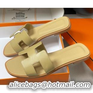 Shop Duplicate Hermes Oran Classic Flat Slides Sandal in Smooth Calfskin Beige 2025 H081803