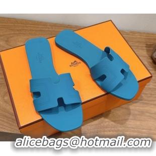 Shop Hermes Oran Classic Flat Slides Sandal in Stitching Rubber Blue 0820192