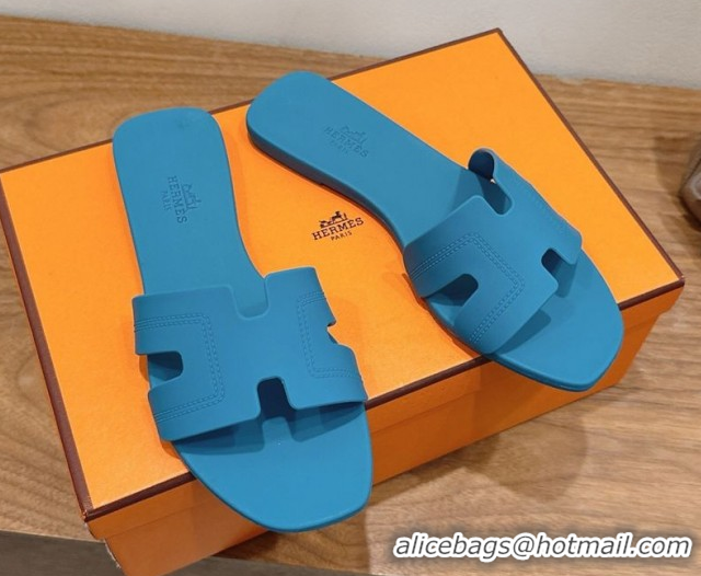 Shop Hermes Oran Classic Flat Slides Sandal in Stitching Rubber Blue 0820192