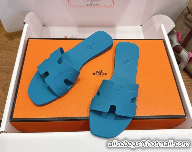 Shop Hermes Oran Classic Flat Slides Sandal in Stitching Rubber Blue 0820192