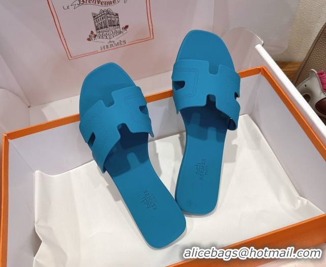 Shop Hermes Oran Classic Flat Slides Sandal in Stitching Rubber Blue 0820192