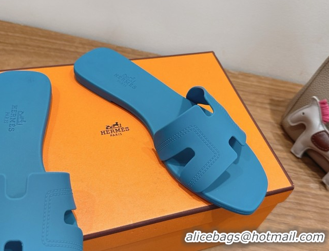 Shop Hermes Oran Classic Flat Slides Sandal in Stitching Rubber Blue 0820192