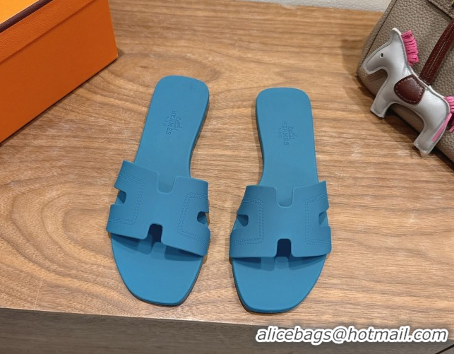 Shop Hermes Oran Classic Flat Slides Sandal in Stitching Rubber Blue 0820192